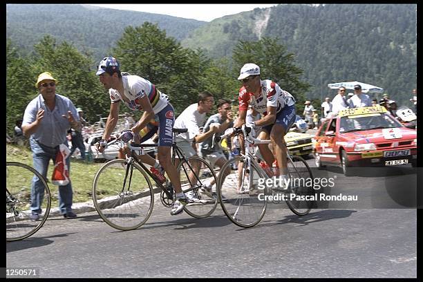 Abraham Olano of Spain leads Miguel Indurain of Spain as they sruggle up the climb during stage 17 of the Tour De France from Argeles Gazost to...