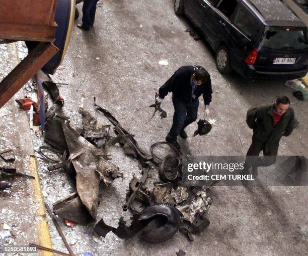 Turkish policeman investigates the rubbles of a car in front of the Neva Shalom synagogue 15 November 2003 in Istanbul, Turkey. Powerful blasts...