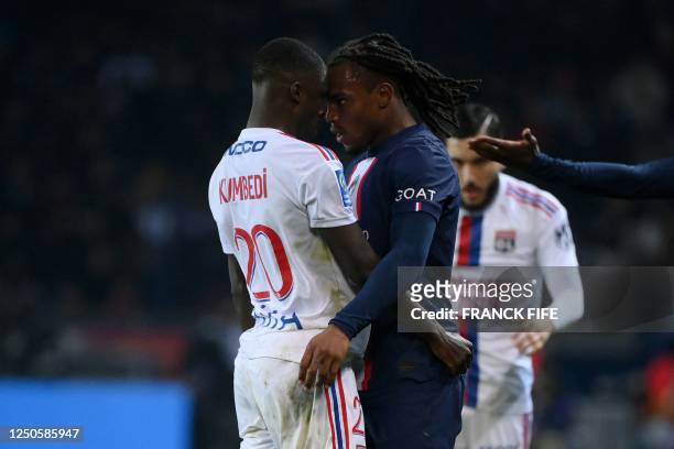 Lyon's French defender Sael Kumbedi and Paris Saint-Germain's Portuguese midfielder Renato Sanches have an arguement during the French L1 football...