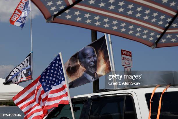 Supporter of former U.S. President Donald Trump flies a flag with an image of President Joe Biden near Trump's Mar-a-Lago home on April 2, 2023 in...