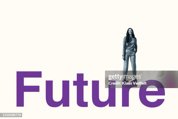 portrait of smiling woman standing on future text - creativity word stock pictures, royalty-free photos & images