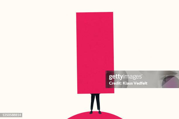 low section of woman carrying large pink column - woman symbol stock pictures, royalty-free photos & images