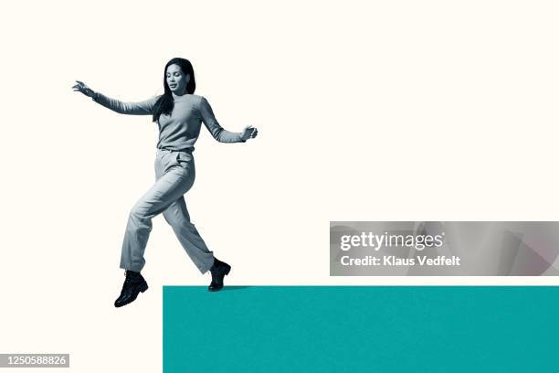 woman about to take first step from green footpath - signaling pathways stock pictures, royalty-free photos & images