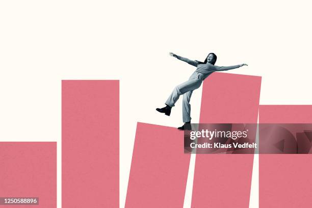 young woman balancing on large coral columns - gefahr stock-fotos und bilder