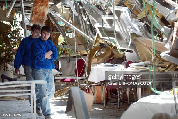 Israelis inspect the damage inside the Park Hotel in Netanya 28 March 2002, following a suicide attack late last night that killed 20 people plus the...