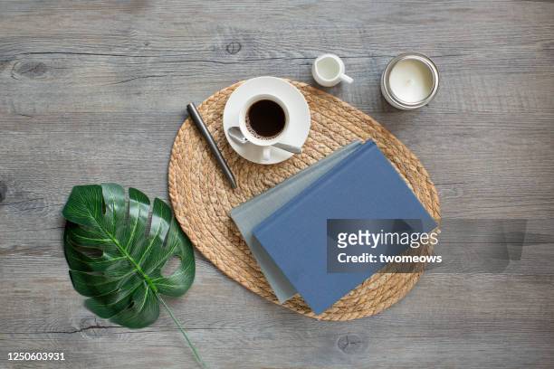 stylised flat lay relaxation reading time with coffee table top still life. - coffee table ストックフォトと画像