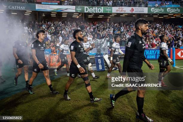 New Zealand and Fiji walk onto the field before the final on the third day of the Hong Kong Sevens rugby tournament on April 2, 2023.
