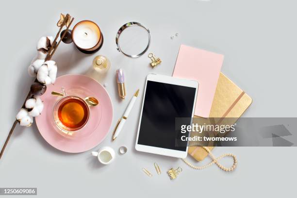 stylised feminine flat lay table top still life. - femminilità foto e immagini stock