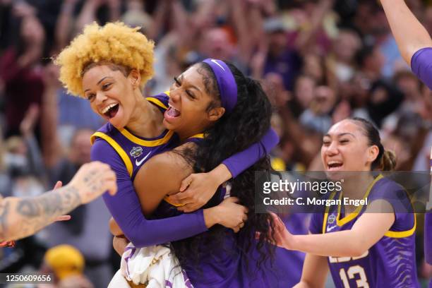 Jasmine Carson and Angel Reese of the Louisiana State Tigers celebrate a three-point goal against the Iowa Hawkeyes during the 2023 NCAA Women's...