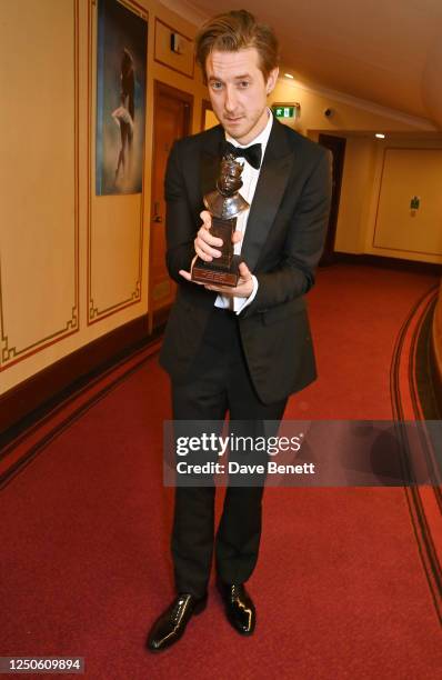 Arthur Darvill, winner of the Best Actor in a Musical award for "Rodgers & Hammerstein's Oklahoma!", poses backstage at The Olivier Awards 2023 at...