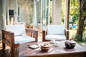 Teak Outdoor Furniture on Deck of Modern Home