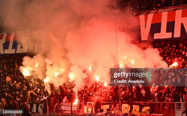 Fans of Paris Saint - Germain burn fumigant during the French Ligue 1 soccer match between Paris Saint-Germain and Olympique Lyonnais at Parc des...