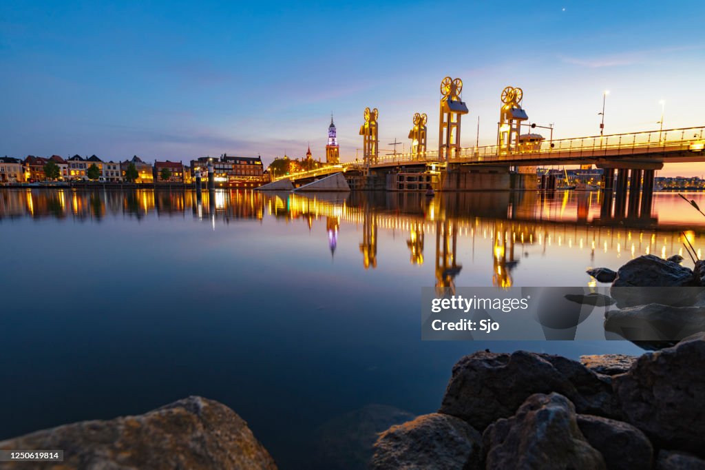 City bridge over the river IJssel in Kampen after sunset during a beautiful springtime evening