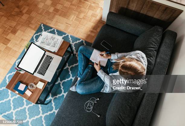 inspired gen-z woman working freelance work from home during quarantine - gen i stock pictures, royalty-free photos & images