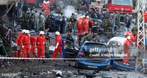 Rescuers and security forces gather at the site of a car bomb attack that killed a Lebanese army general in Baabda 12 December 2007. Lebanese army...