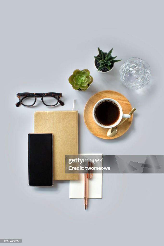 Stylised modern flat lay domestic working table top still life.