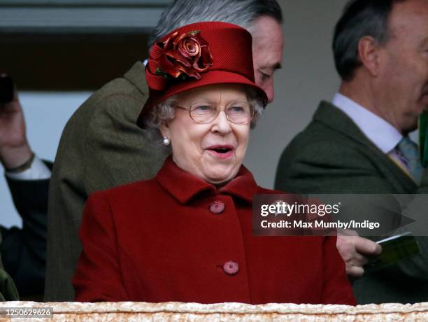 Queen Elizabeth II reacts as she watches the racing on day 4 'Gold Cup Day' of the Cheltenham Festival at Cheltenham Racecourse on March 13, 2009 in...