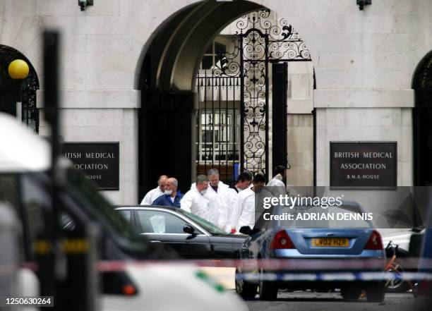 Forensic officers carry a body bag outside the British Medical Association in London, 08 July close to where a terrorist bomb exploded on a bus the...