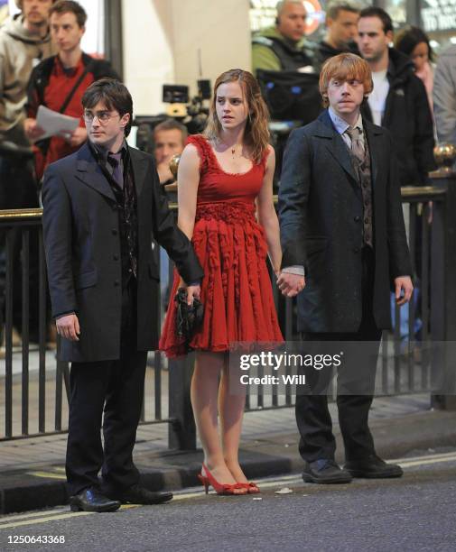 Daniel Radcliffe, Emma Watson and Rupert Grint film scenes for the new Harry Potter movie at Piccadilly Circus and the Trocadero Centre on April 22,...