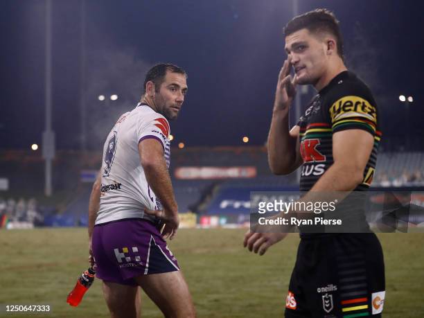 Cameron Smith of the Storm passes Nathan Cleary of the Panthers after the round six NRL match between the Penrith Panthers and the Melbourne Storm at...