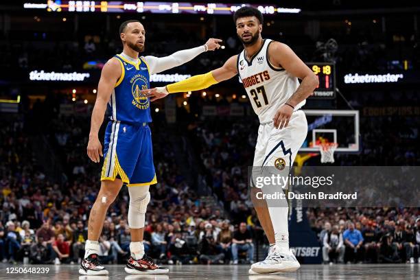 Stephen Curry of the Golden State Warriors is defended by Jamal Murray of the Denver Nuggets in the second half of a game at Ball Arena on April 2,...
