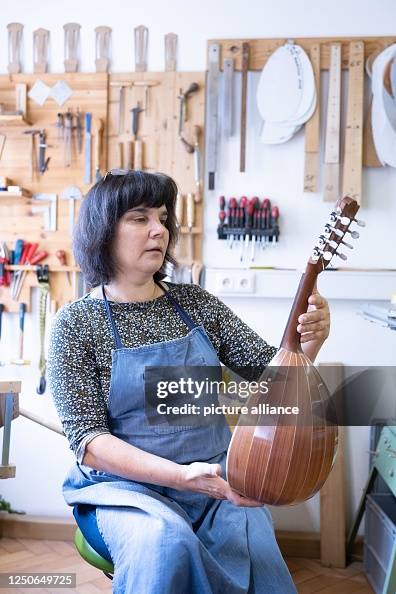 Mandolin Inventor Brunhilde Jacob, mandolin maker, sits in her workshop holding a... News ...