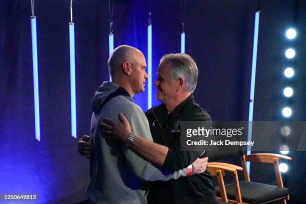 Head coach Dan Hurley of the Connecticut Huskies, left, and head coach Brian Dutcher of the San Diego State Aztecs hug during the Final Four Media...