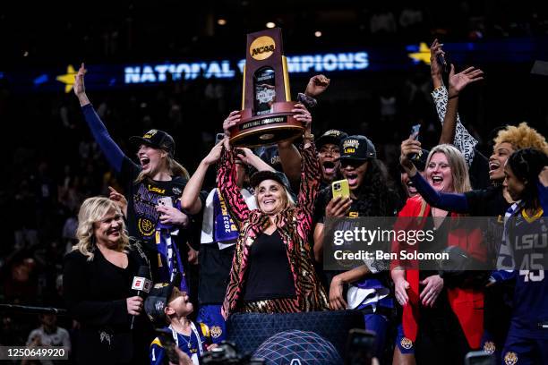 Head coach Kim Mulkey of the LSU Lady Tigers celebrates with the trophy after winning the 2023 NCAA Women's Basketball Tournament championship game...