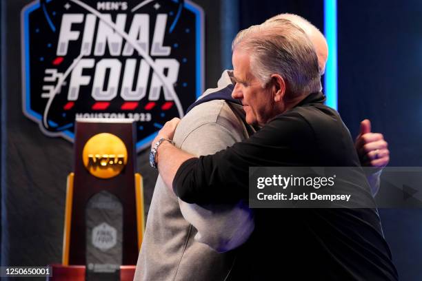 Head coach Dan Hurley of the Connecticut Huskies, left, and head coach Brian Dutcher of the San Diego State Aztecs hug following a Final Four Media...