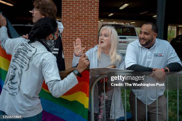 Event facilitators peacefully clash with Christian protesters before a drag show and story hour held at East Tennessee State University in Johnson...