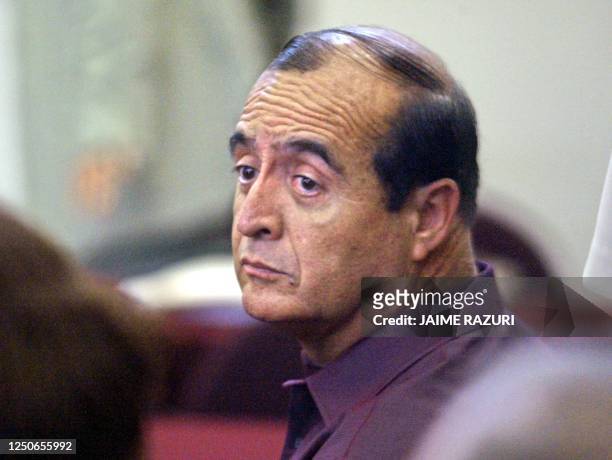 Vladimiro Montesinos , former Peruvian President Alberto Fujimori's right-hand man, stares as he arrived at a judiciary courthouse in Lima, 20...
