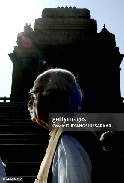 India's Deputy prime minister and the leader of the ruling Bhartiya Janata Party L.K. Advani walks in front of the Viveknanda Memorial on the...