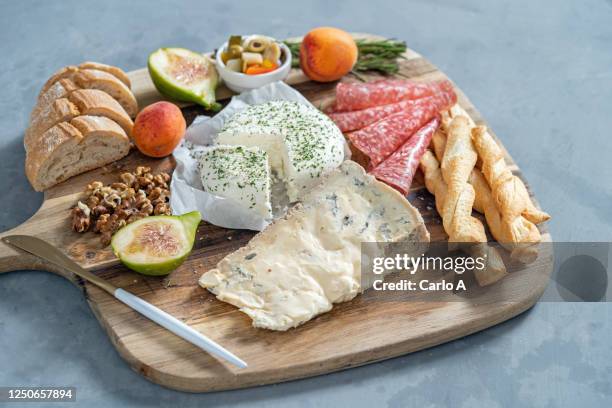 platter of cheese, bread and salami. - french cheese stock pictures, royalty-free photos & images