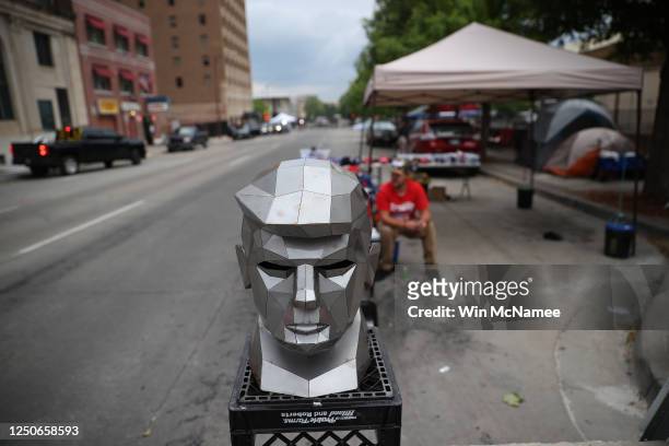Metal bust of U.S. President Donald Trump is on display outside the BOK Center as people line up to attend his campaign rally tomorrow June 19, 2020...