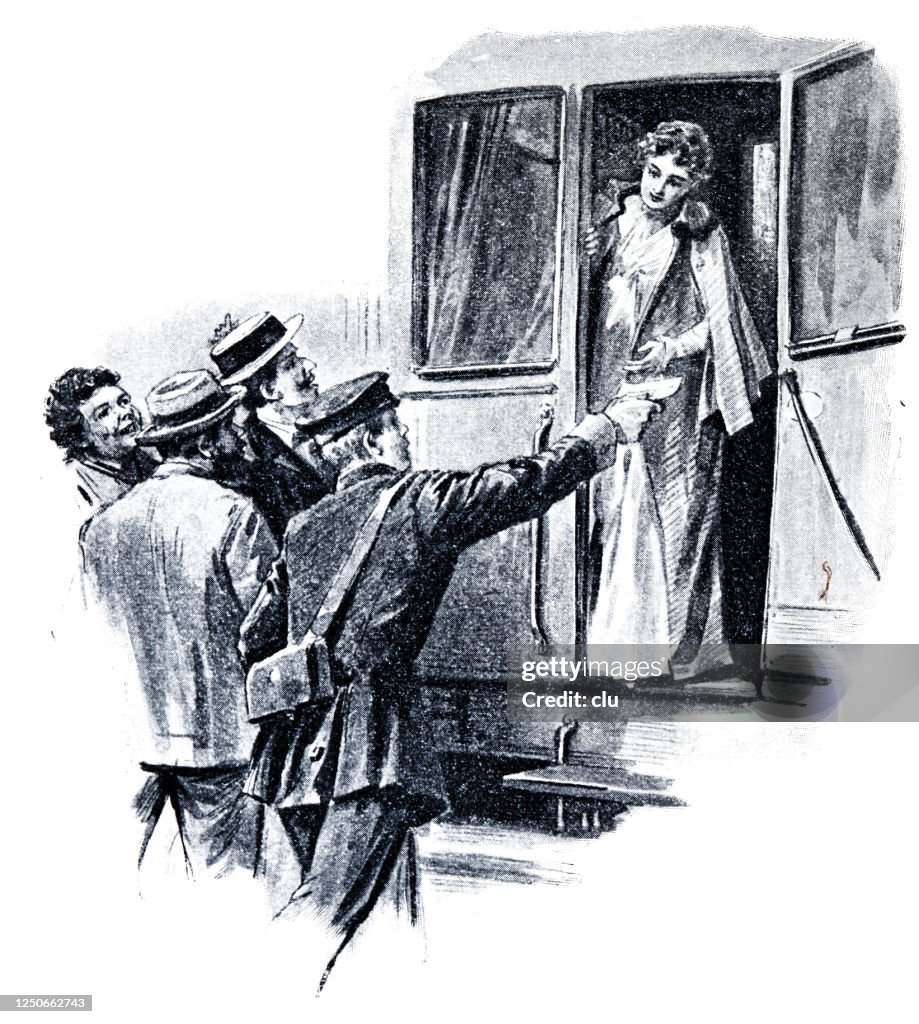 The controller hands over a ticket to the train traveler