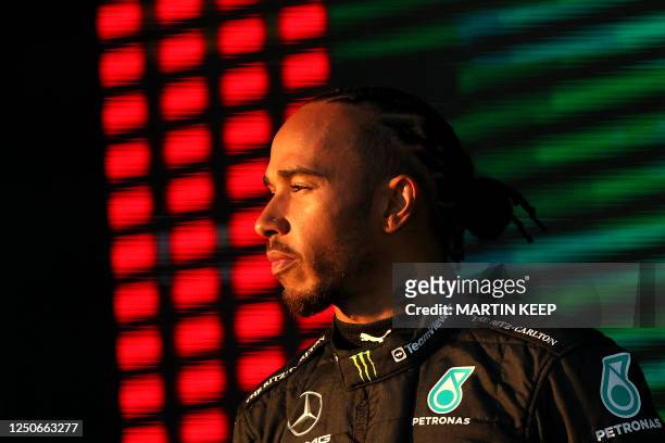 Mercedes' British driver Lewis Hamilton stands on the podium after the 2023 Formula One Australian Grand Prix at the Albert Park Circuit in Melbourne...