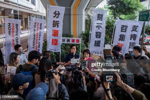 Ken Lui, leader of the Spin Off HSBC Asia Concern Group, center left, and Christine Fong Kwok-shan, a councilor for Hong Kong's Sai Kung district who...