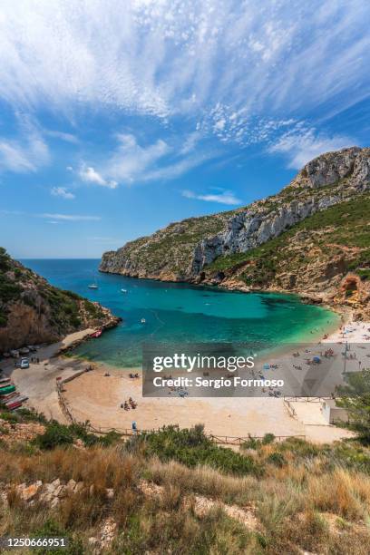 small cove not crowded in the spanish litoral, mediterranean sea. cala granadella, jávea, spain - javea stock pictures, royalty-free photos & images