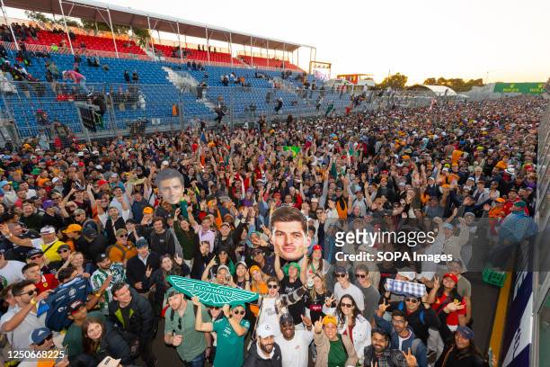 Fans celebrating on the track following the Formula One Australian Grand Prix at the Albert Park Circuit in Melbourne on April 2, 2023.