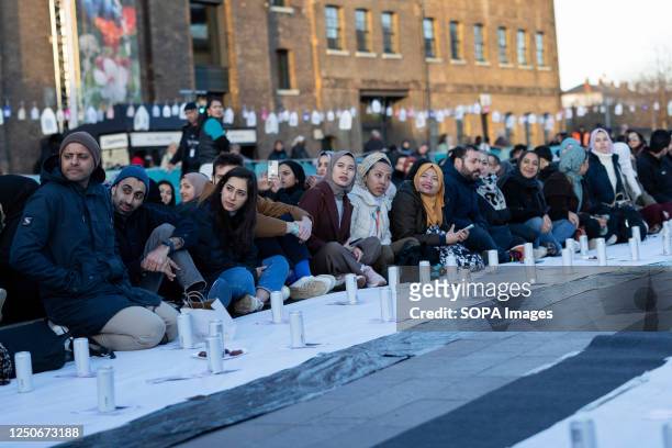 Muslims are seen taking their seats and waiting for the sunset for Iftar. Open Iftar has organized a series of Iftar events across the UK to mark the...