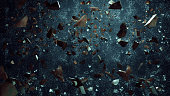 Rock stone and glass broken splash explosion isolated on dirty background