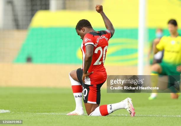 Michael Obafemi of Southampton takes a knee in support of the Black Lives Matter movement during the Premier League match between Norwich City and...