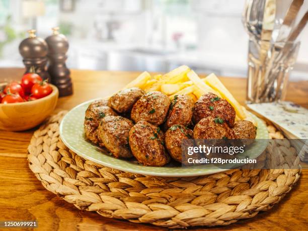 meatball plate on the kitchen table. - turkey meat balls stock pictures, royalty-free photos & images