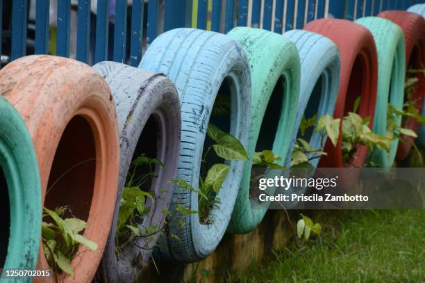 tires - potted plants - formal garden gate stock pictures, royalty-free photos & images