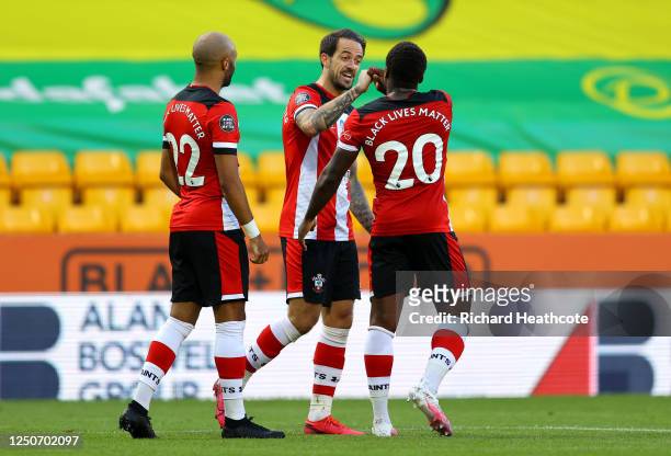 Danny Ings of Southampton celebrates with Nathan Redmond and Michael Obafemi after scoring his team's first goal during the Premier League match...