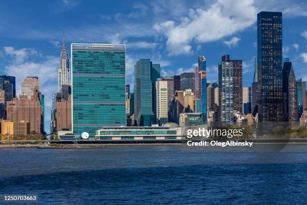 un building, chrysler building and skyscrapers of manhattan east side, new york, usa - united nations building stock pictures, royalty-free photos & images