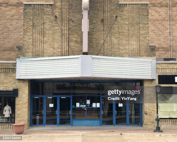 covid-19 pandemic empty street scene with shut down movie theater with no shows - entrance sign stock pictures, royalty-free photos & images