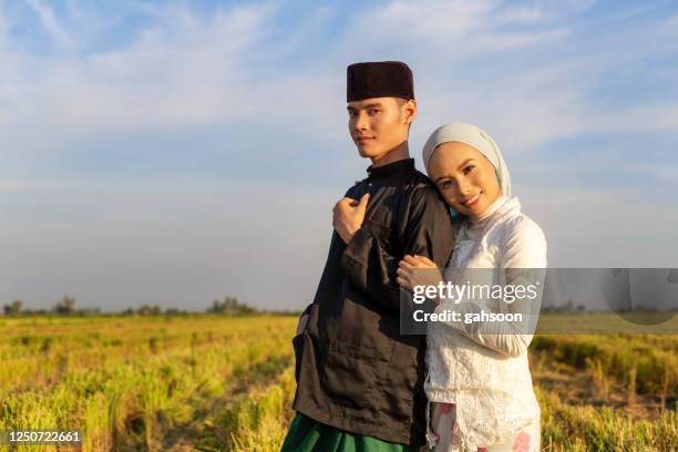 beautiful malay couple posing for portrait - malay lover stock pictures, royalty-free photos & images