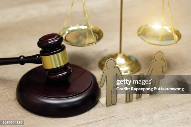 family law concept. family paper and hammer on the table - family law stockfoto's en -beelden