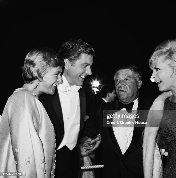 Actor Dick Van Dyke and his wife Margie chat with actor George Jessel at the 39th Academy Awards in Santa Monica, Los Angeles, 10th April 1967. Van...